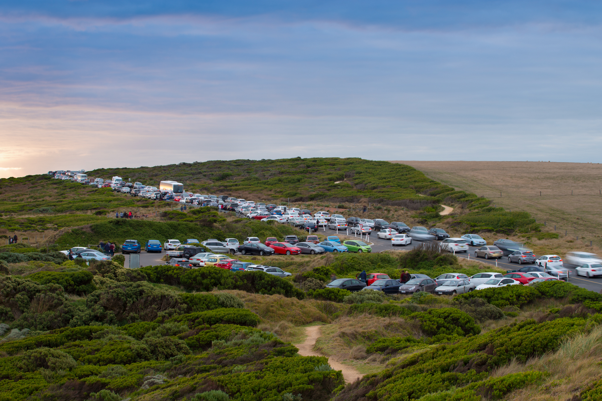 Cars parked long the Great Ocean Road.