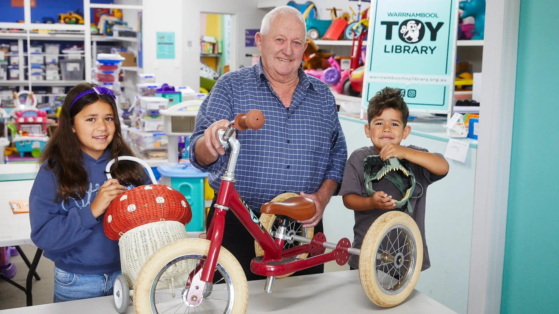 Bruce Morton with Warrnambool Toy Library members Eseta Tuisuva (left) and Isoa Tuisuva