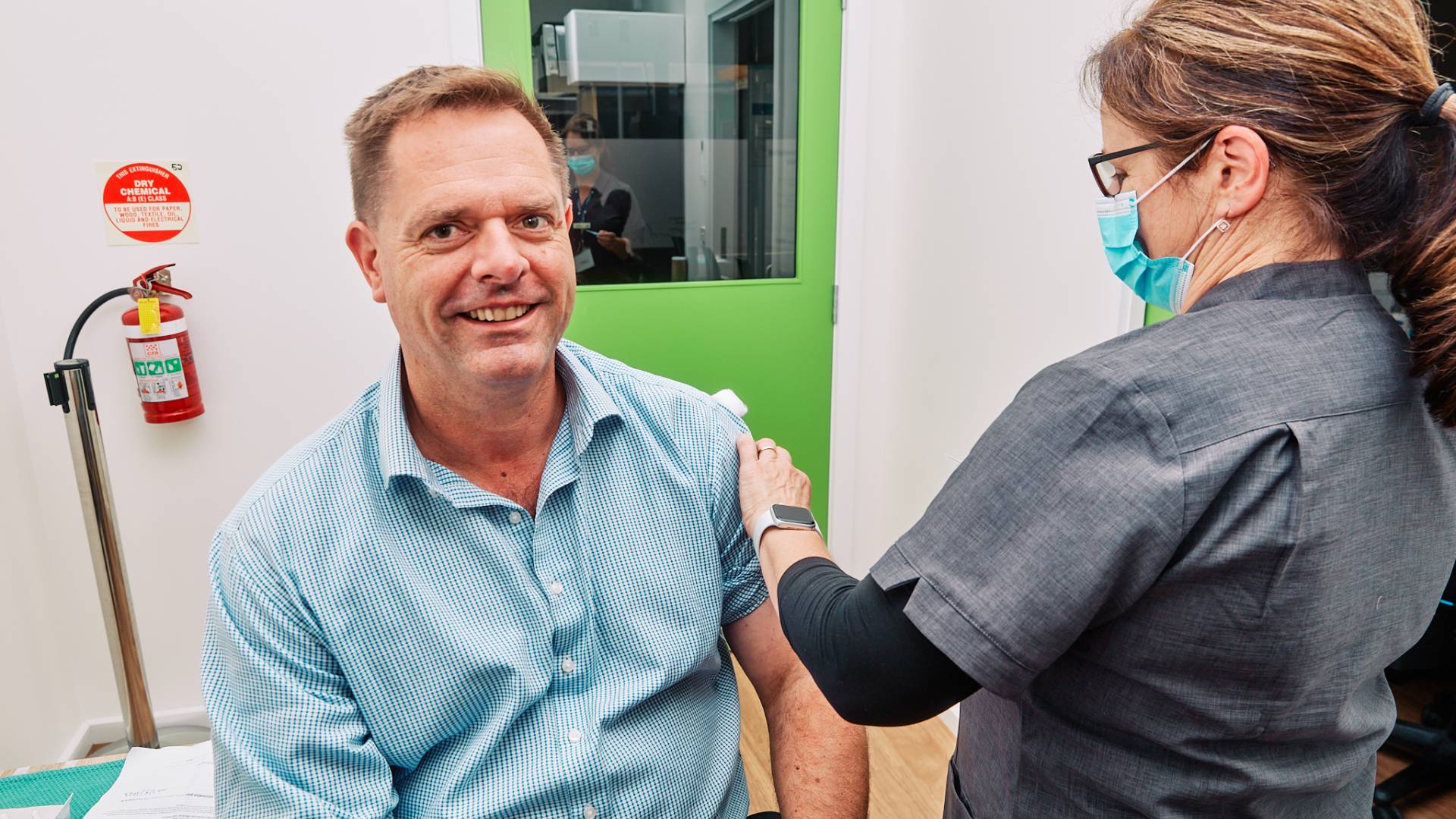 CEO Andrew Mason receiving his flu shot