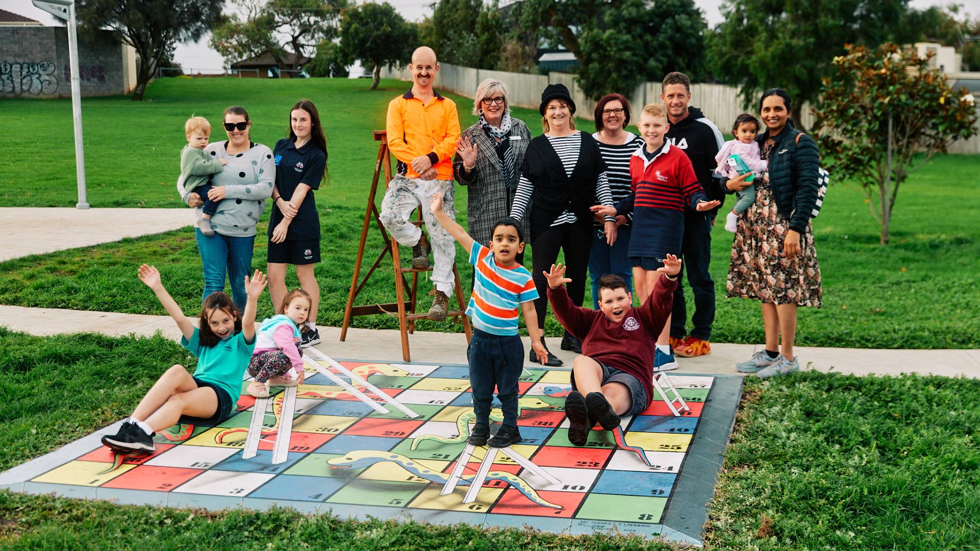 Artist Jimmi Buscombe, Nayor Debbie Arnott, West Warrnambool Neighbourhood House Coordinator Jill Bourke and local resident at the Pecten Avenue playground