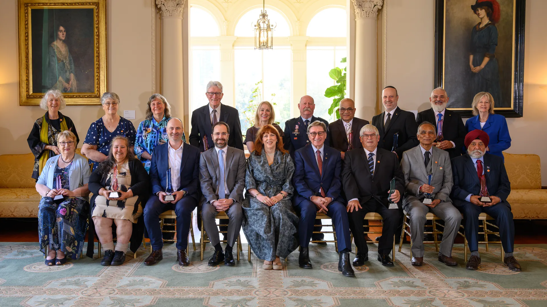 Jeanette Hajncl and John MacInnes with fellow award recipients and dignitaries