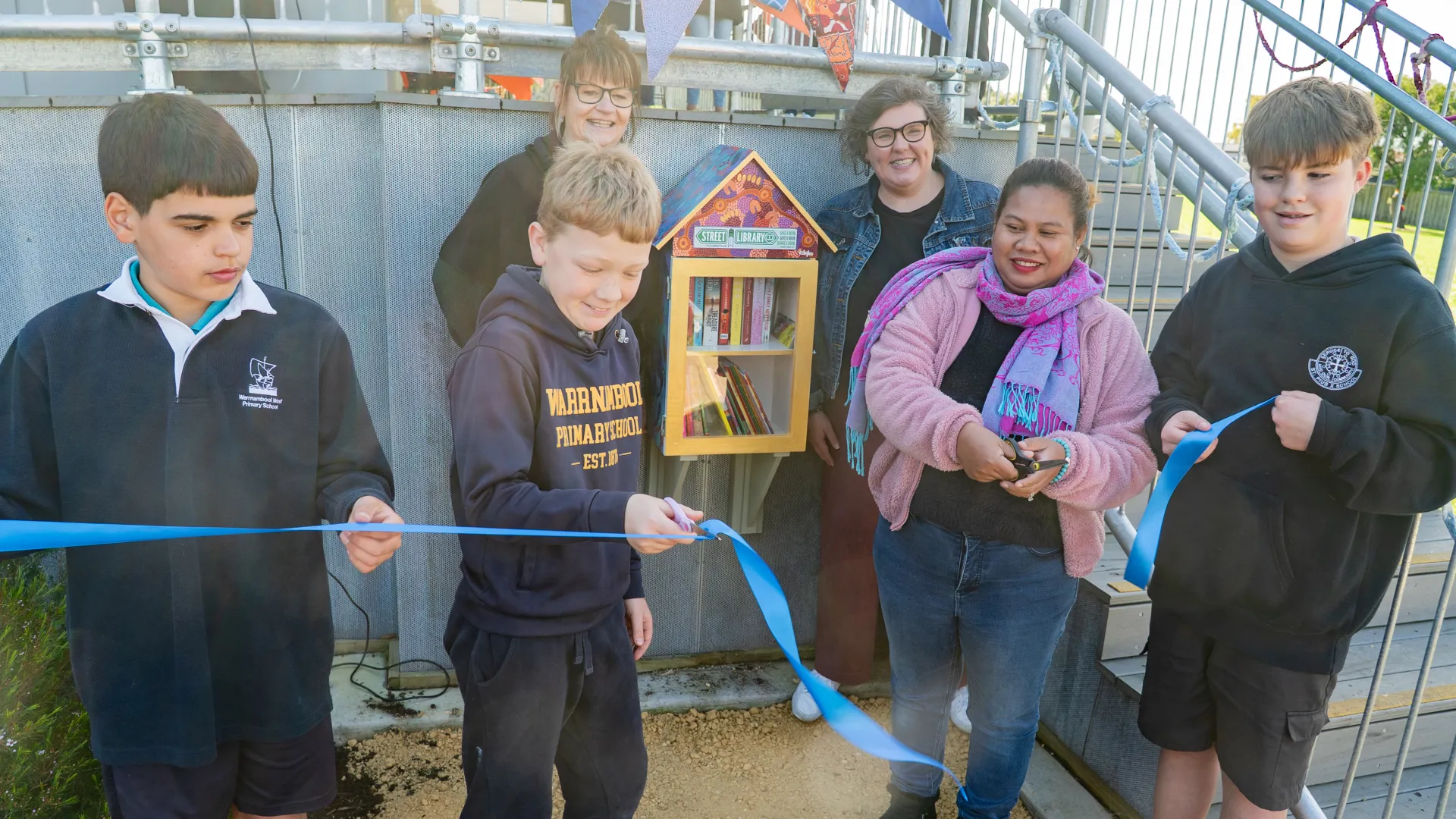 Ribbon cutting at the launch of the Pecten Park Street Library