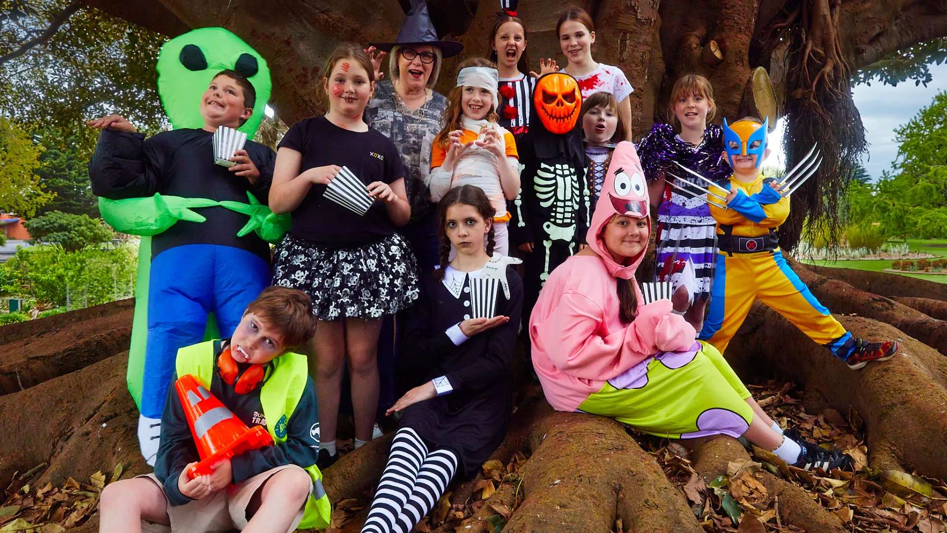 Cr Debbie Arnott with a spooky group of children, excited for Halloween