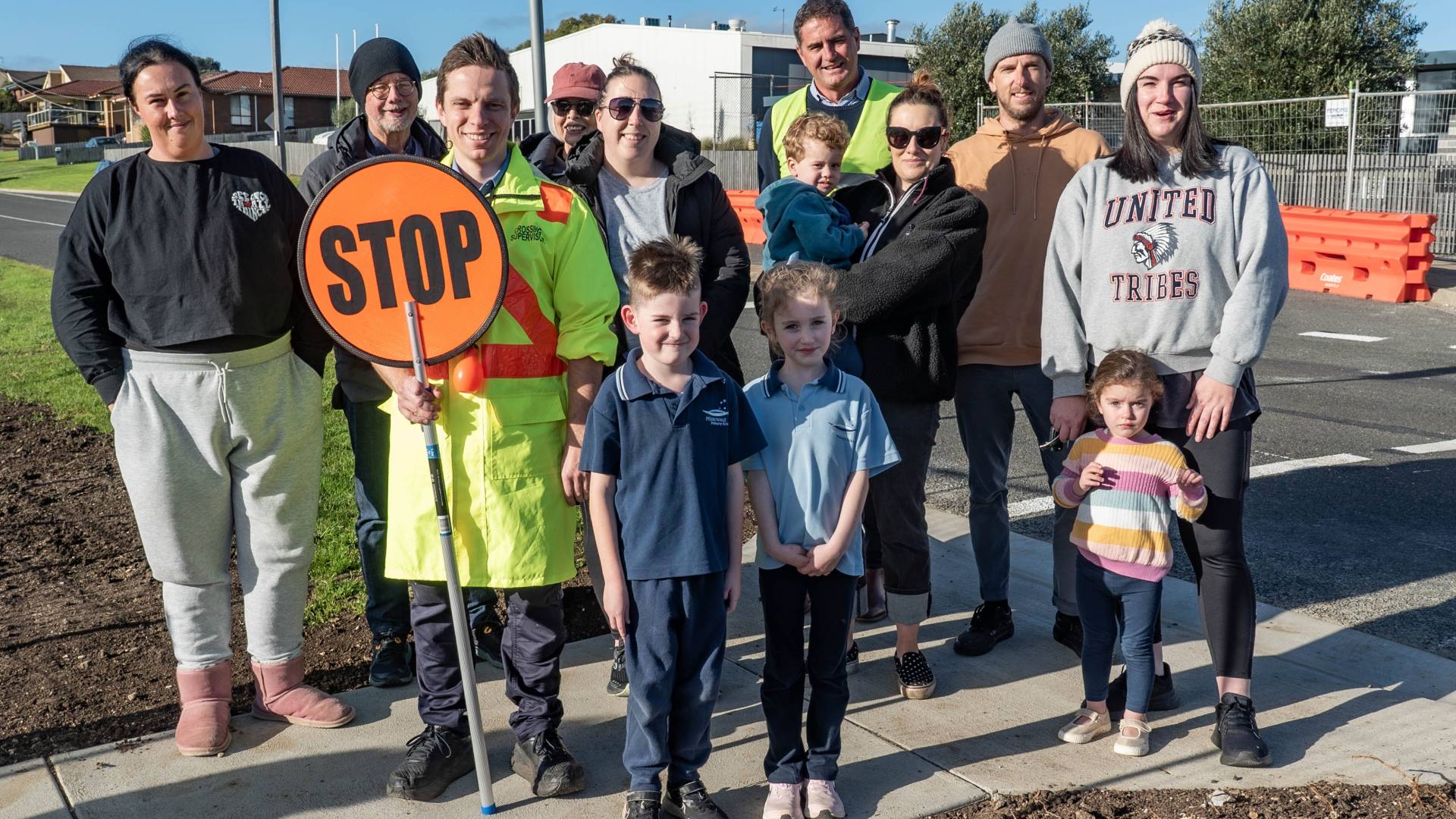 Local Laws Officer and School Crossing Supervisor Jesse Torpy with Principal Simon Perry (yellow vest) and Merrivale PS families