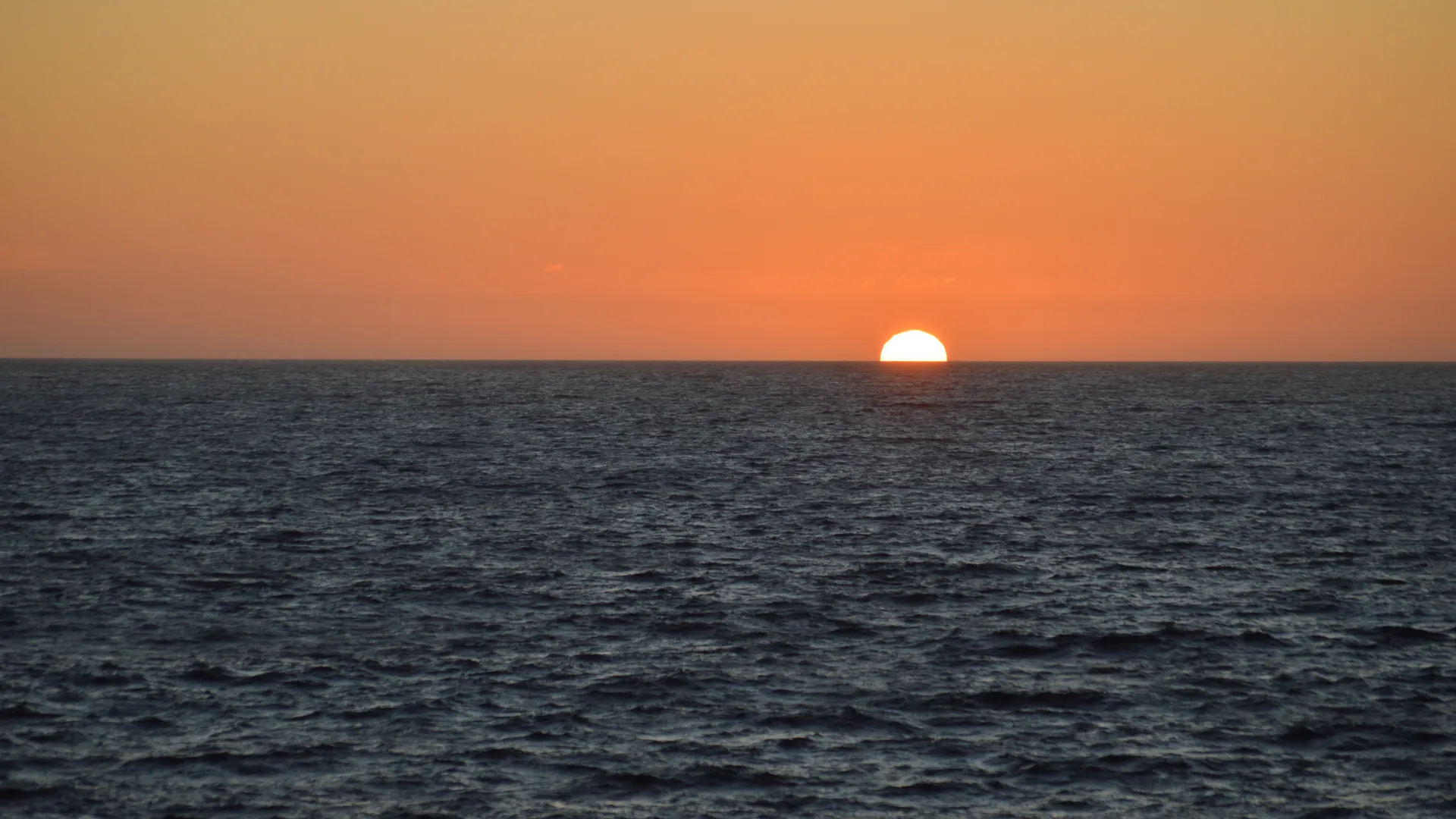 Sun setting beyond the Southern Ocean.