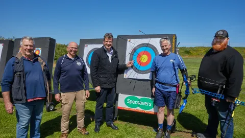 Cr Willy Benter (centre) with members of the Archers of Warrnambool