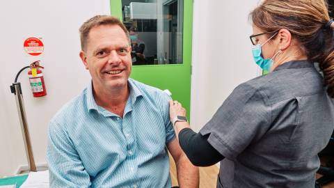 CEO Andrew Mason receiving his flu shot
