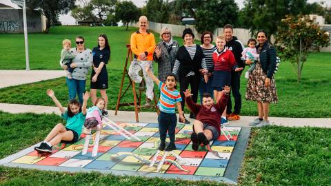 Artist Jimmi Buscombe, Nayor Debbie Arnott, West Warrnambool Neighbourhood House Coordinator Jill Bourke and local resident at the Pecten Avenue playground
