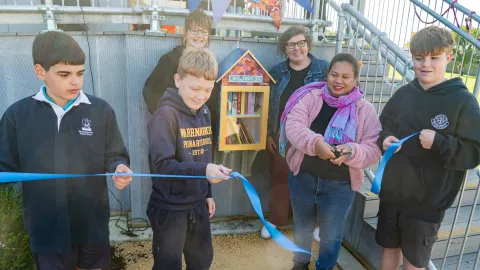 Ribbon cutting at the launch of the Pecten Park Street Library