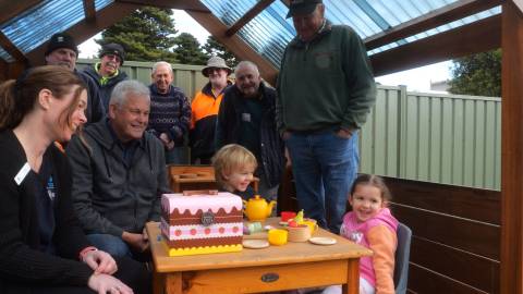 Men's shed members with Dennington kinder staff and students in the new cubby