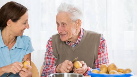 Older man receiving help in the home