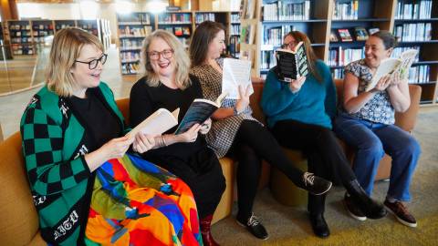 Library team diving into crime novels.