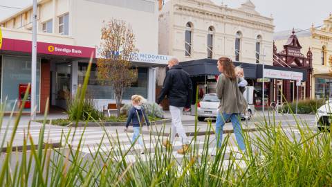 Young family crossing a street in Warrnambool's city centre.