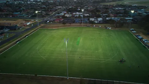 Brierly Reserve with the lights on the playing field.