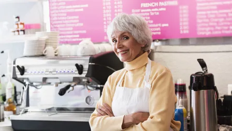 Older worker in cafe