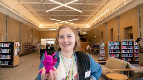 Digital Tech Programs Library Officer Rhea Kirkwood with a 3D-printed Pikachu.