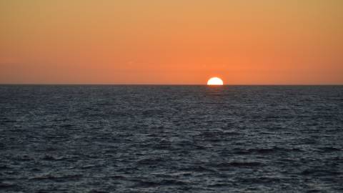Sun setting beyond the Southern Ocean.